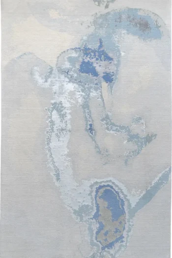 handknotted Surreal luxury wool and silk abstract rug in ocean blue and slate blue, with fibers showing luminous sheen.