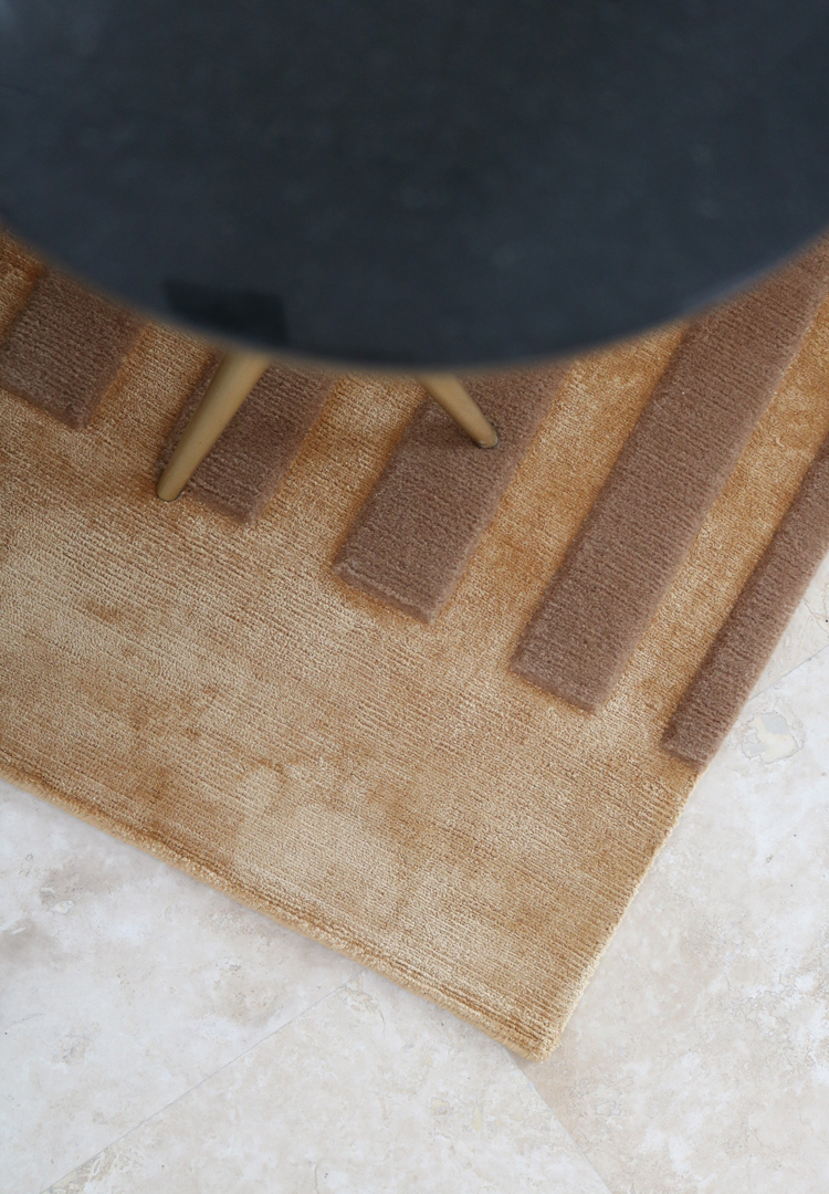 geometric design rug from rug art, in rich radian brown tones.