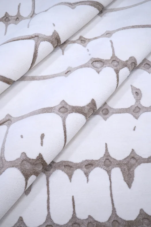 Sonata custom luxury rug with hand carved lines, rhythmic pattern andlayered texture, part of Rug Art's Form collection.