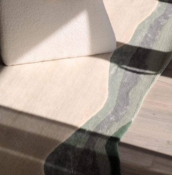 irregular handmade rug with a border.